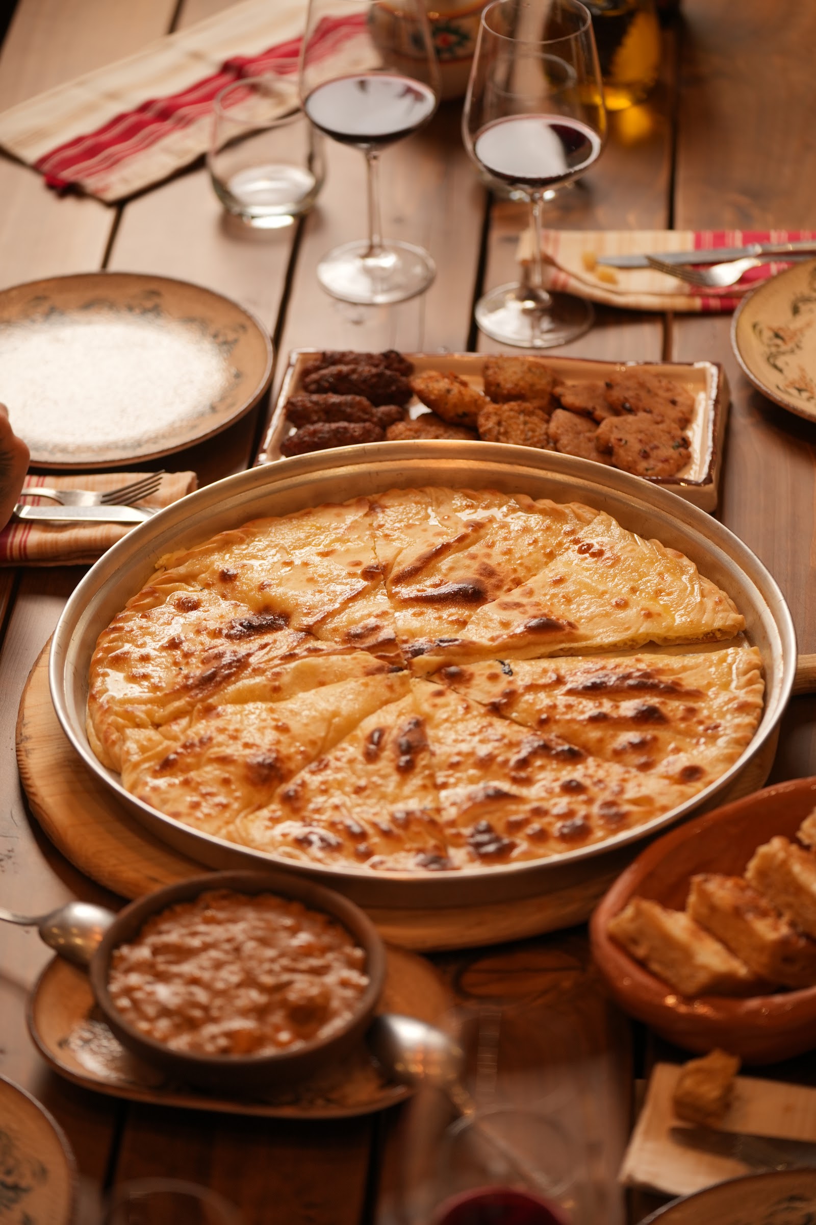 Traditional Albanian spread with lakror pie and wine
